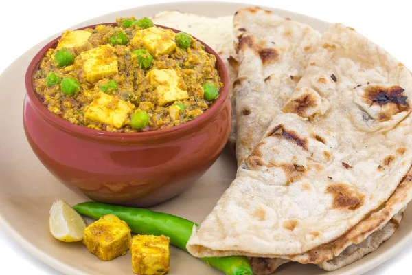 Indian Cuisine Mattar Paneer is a Vegetarian North Indian Dish Consisting of Peas And Paneer in a Tomato Based Sauce, Spiced with Garam Masala. It is often Served with Indian type of Tandoori Roti
