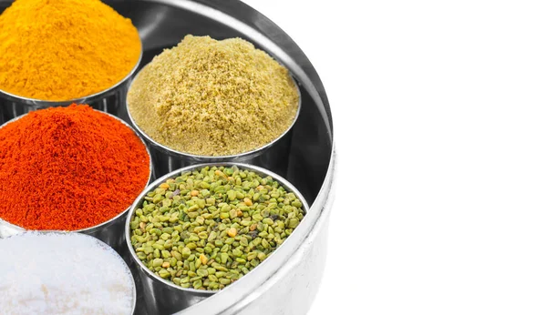 Indian Colorful Spices Also Know as Red Chilli Powder, Turmeric Powder, Coriander Powder, Salt, Green Fenugreek Seeds, Namak, Mirchi, Haldi or Dhaniya Powder Isolated on White Background