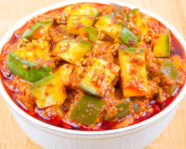 Indian Traditional Raw Mango Pickle Also Know as Aam Ka Achar or Kari Ka Achar on Wooden Background
