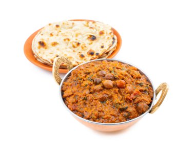 Hint Sağlıklı Mutfağı Chana Masala. Baharatlı Nohut, Channay, Chole Masala veya Chholay olarak da bilinir. Baharatlı Soğan Domates Masala Sosu 'nda Nohut Pişirerek Pişirilen Lezzetli ve Lezzetli Köri.