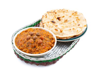 Hint Sağlıklı Mutfağı Chana Masala. Baharatlı Nohut, Channay, Chole Masala veya Chholay olarak da bilinir. Baharatlı Soğan Domates Masala Sosu 'nda Nohut Pişirerek Pişirilen Lezzetli ve Lezzetli Köri.