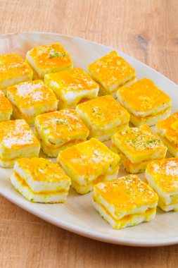 Paneer Burfi ya da Paneer Kesar Burfi (İngilizce: Paneer Burfi, İngilizce: Paneer Burfi, İngilizce: Paneer Burfi, İngilizce: Paneer Burfi, İngilizce: Paneer Burfi, İngilizce: Paneer Burfi, İngilizce: Paneer Burfi veya Paneer Kesar Burfi)