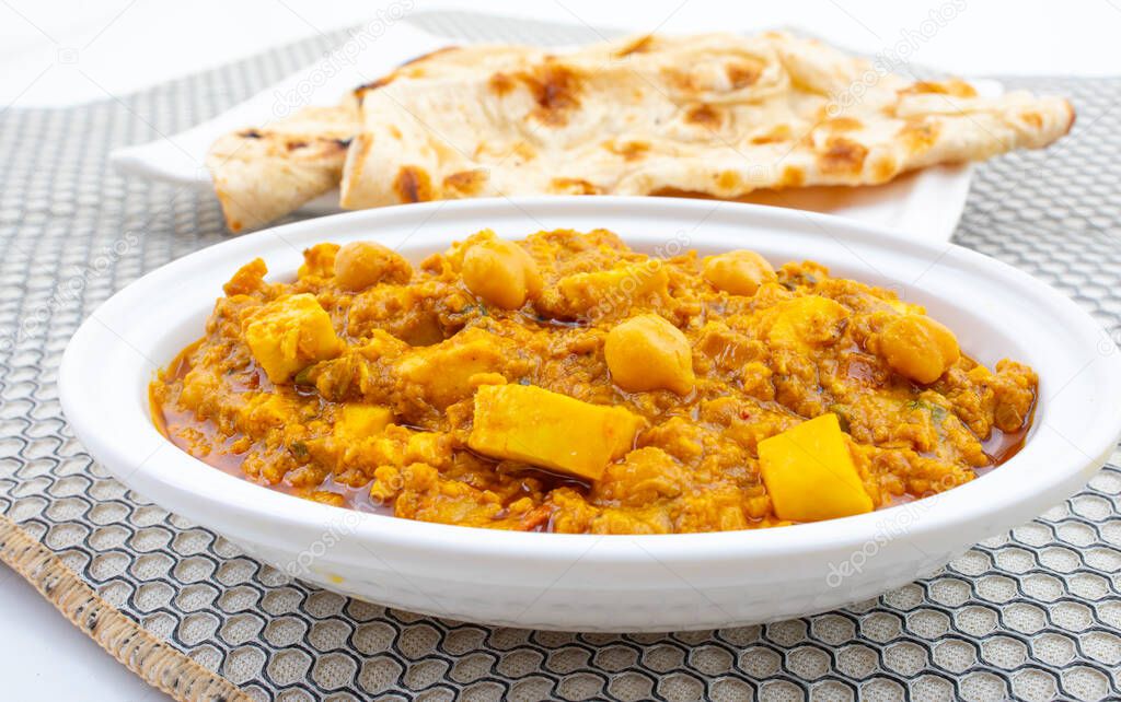 North Indian Healthy Cuisine Chole Paneer or Chole Paneer Curry Served with Tandoori Roti, Made From Boiled Chickpea with Cottage Cheese and Spices