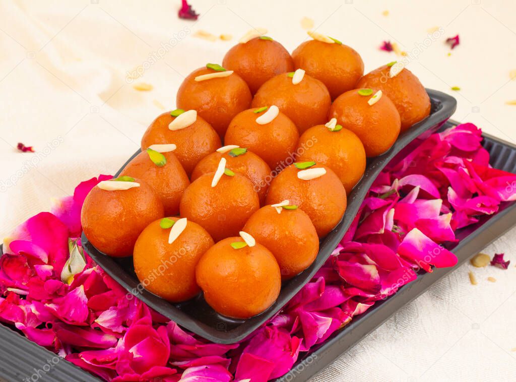 Indian Popular Dessert Gulab Jamun Also know as kala Jamun or Kalajam is a Soft Delicious Berry Sized Balls Made of Milk Solids