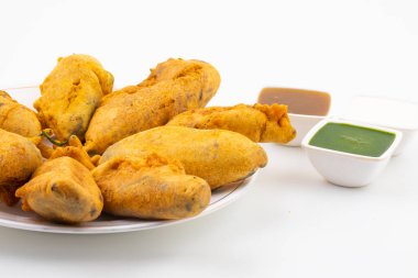 Hint Sos ve Chili Pakora, Mirchi Bajji, Mirchi Vada, Mirchi Bada, Chili Cutlet veya Chili Bajji olarak da bilinir. Hindistan 'dan popüler bir çay saati atıştırmalığı.