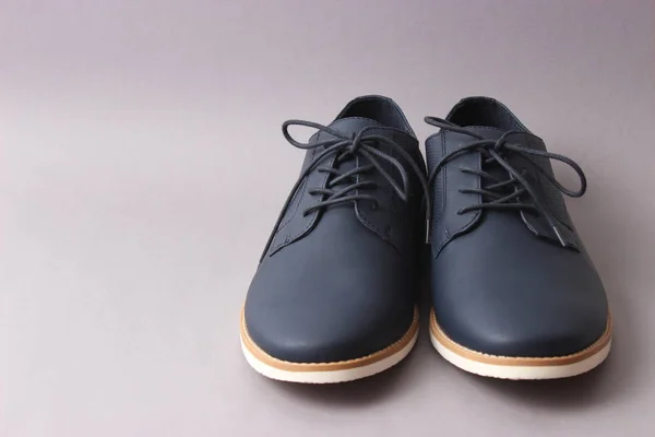 men's classic shoes on a gray background. men's shoes, minimalism