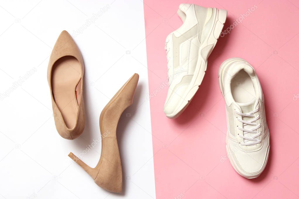 white sneakers and high heel shoes on a colored background top view. Women's shoes. Classic and sport shoes.
