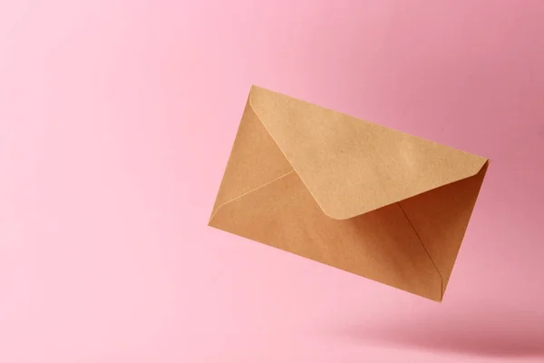 The envelope falls to the ground on a colored background.