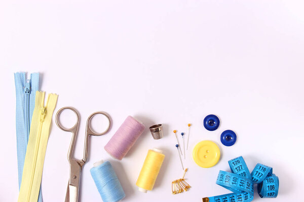 sewing accessories on white background 