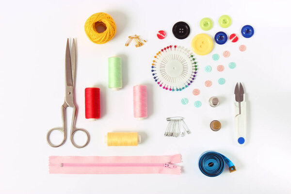 sewing accessories on white background 