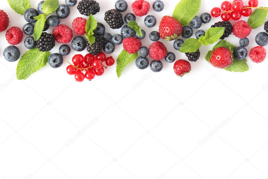 wild berries and mint leaves on a white background top view. blueberries, raspberries, strawberries, currants, blackberries