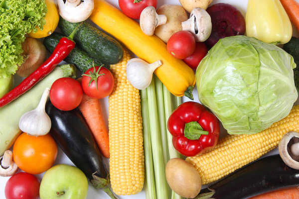 Set of different fresh vegetables on a white background top view.