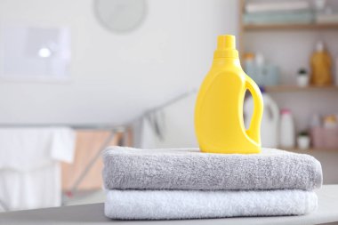 clean towels and laundry detergents in the laundry room