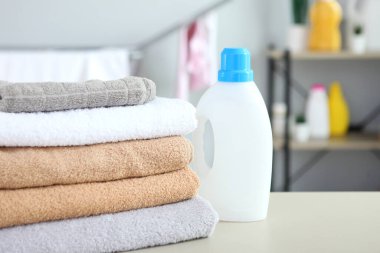 clean towels and laundry detergents in the laundry room