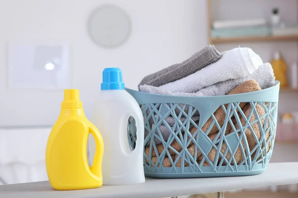 clean towels and laundry detergents in the laundry room