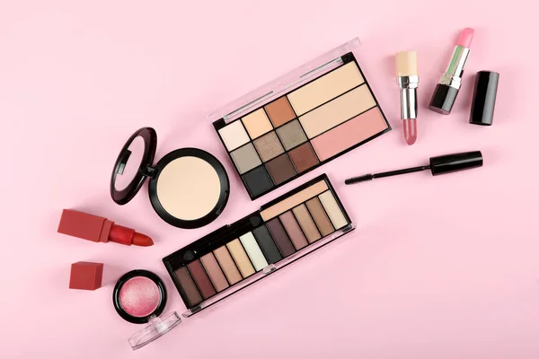 professional makeup tools. Makeup products on plain background top view. A set of various items for makeup.