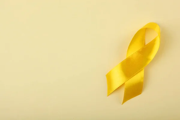 Yellow Ribbon Symbolizing Cancer Children Top View — Stock Photo, Image