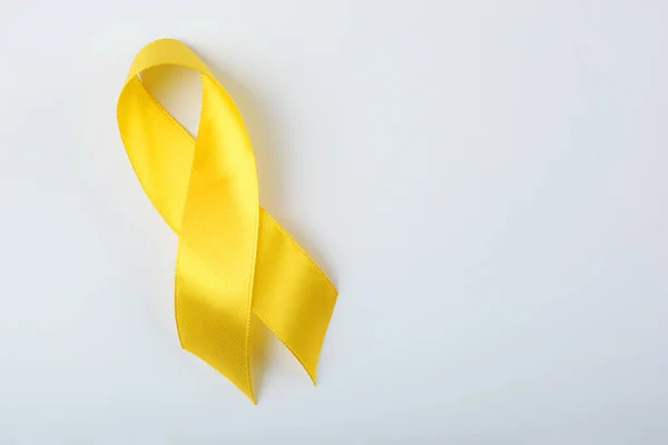 Yellow Ribbon Symbolizing Cancer Children Top View — Stock Photo, Image