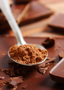 Pieces of chocolate on the table. High quality photo. Vertical photo format