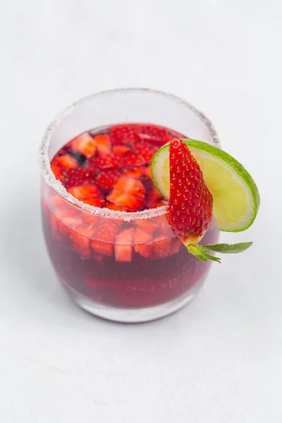 Classic frozen strawberry and lime margarita with fresh strawberries. Valentine\'s dessert recipe. Strawberry juice.