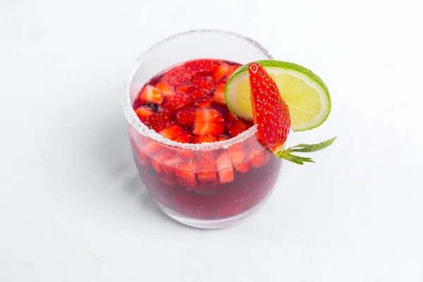 Classic frozen strawberry and lime margarita with fresh strawberries. Valentine\'s dessert recipe. Strawberry juice.