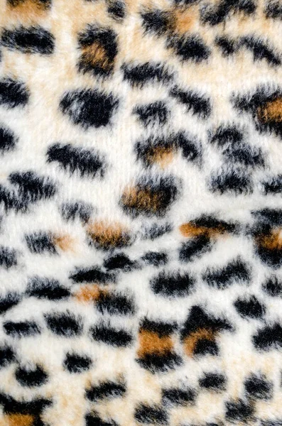 Brown leopard fur pattern. Animal print as background.