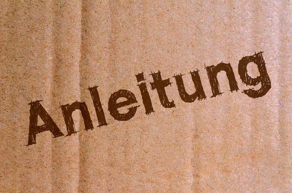 Anleitung Karton Karton Mit Braunen Buchstaben — Stockfoto