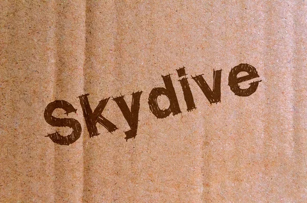 Skydive Cartone Cartone Con Lettere Marroni — Foto Stock