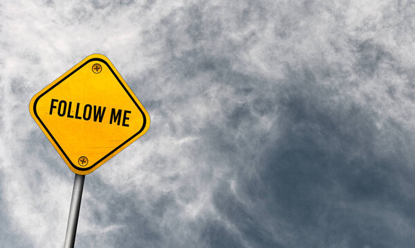 follow me - yellow sign with cloudy sky
