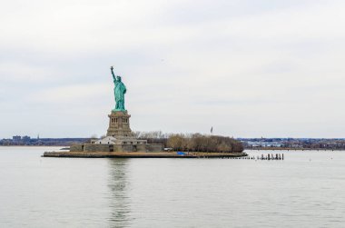 Statue of liberty in the evening, New York with reflection