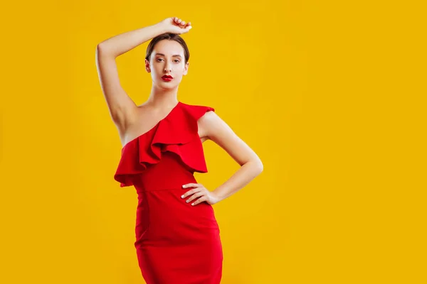 Beautiful Woman Posing Red Dresover Yellow Background — Stock Photo, Image