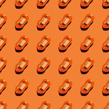 Papaya yaratıcı tropikal desen canlı turuncu arkaplan.