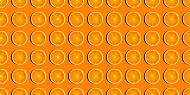 Renkli arka planda taze portakal dilimlerinin renkli meyve deseni.