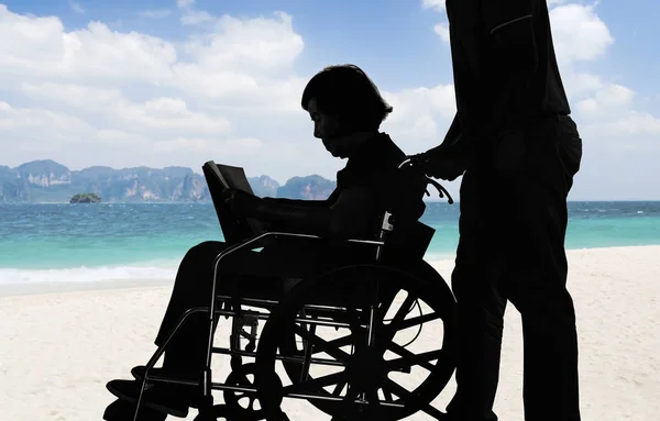 Silhouette Elderly Woman Reading Book Wheelchair Her Son Take Care — Stock Photo, Image