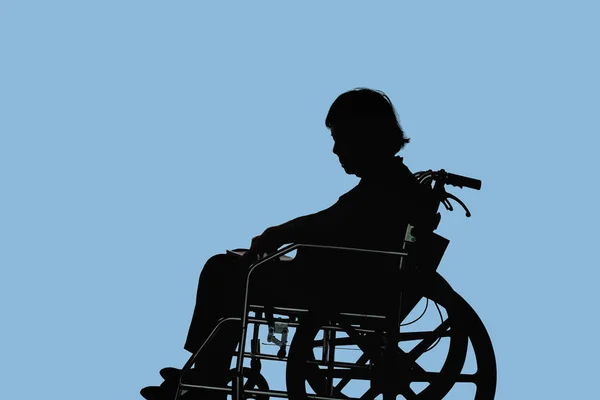 Silhueta Mulher Idosa Deficiente Dejetada Sentada Sua Cadeira Rodas — Fotografia de Stock