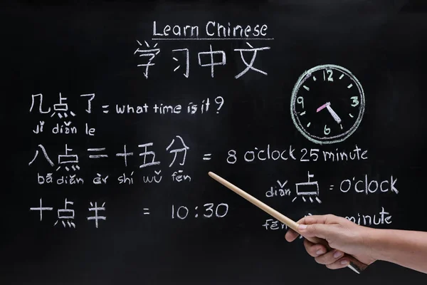 Learning chinese to tell time in class room.