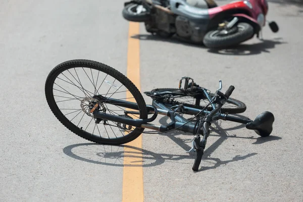 Accident motorcycle crash with bicycle on road