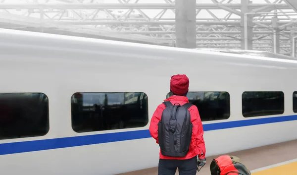 solo travelling , middle aged asian female tourist travel with high-speed train