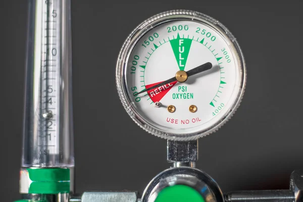 Close-up of medical oxygen flow meter  shows low oxygen or an nearly empty tank