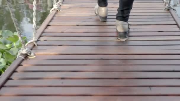 Walking Pedestrian Suspension Bridge — Stock Video
