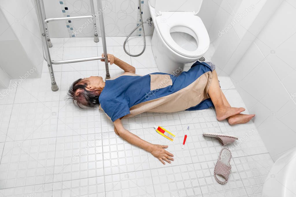 Elderly woman falling in bathroom because slippery surfaces