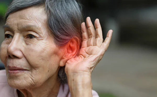 Elderly woman hearing loss , Hard of hearing