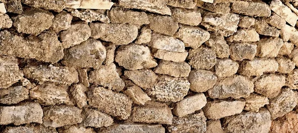 Parede de pedra fundo de construção muito antiga fachada contruction — Fotografia de Stock