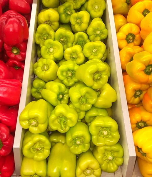 Fruits of sweet pepper - red, orange, yellow or brown, various shapes and sizes.