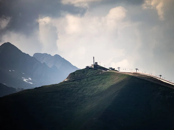 Cable Car Line Sits Top Hill Amidst Mountains Cloudy Day — Stock Photo, Image