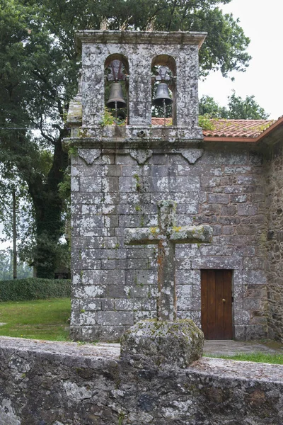 old stone building with ring bells