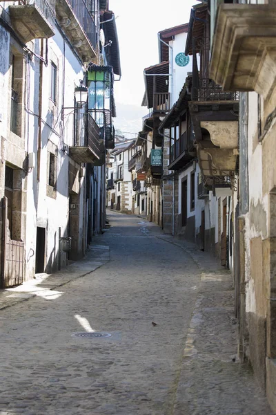 diminishing perspective view of narrow street with old buildings
