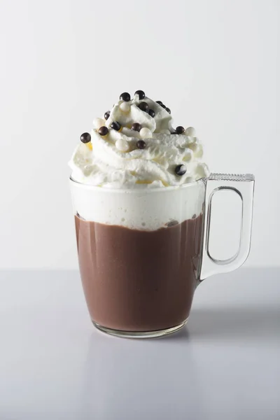 glass cup of cacao with whipped cream