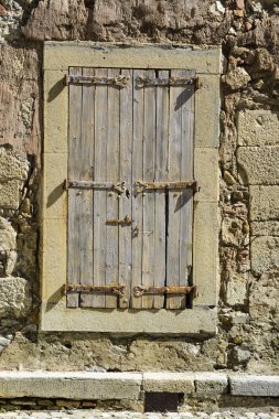 Window with wooden contras of a rustic house in France