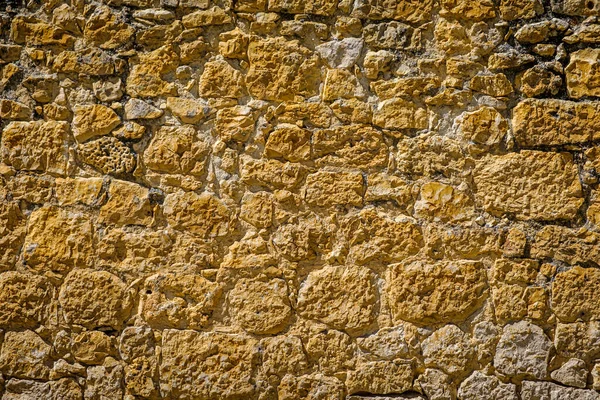 Wall built with masonry in a village in the interior of Spain, in a rural area.